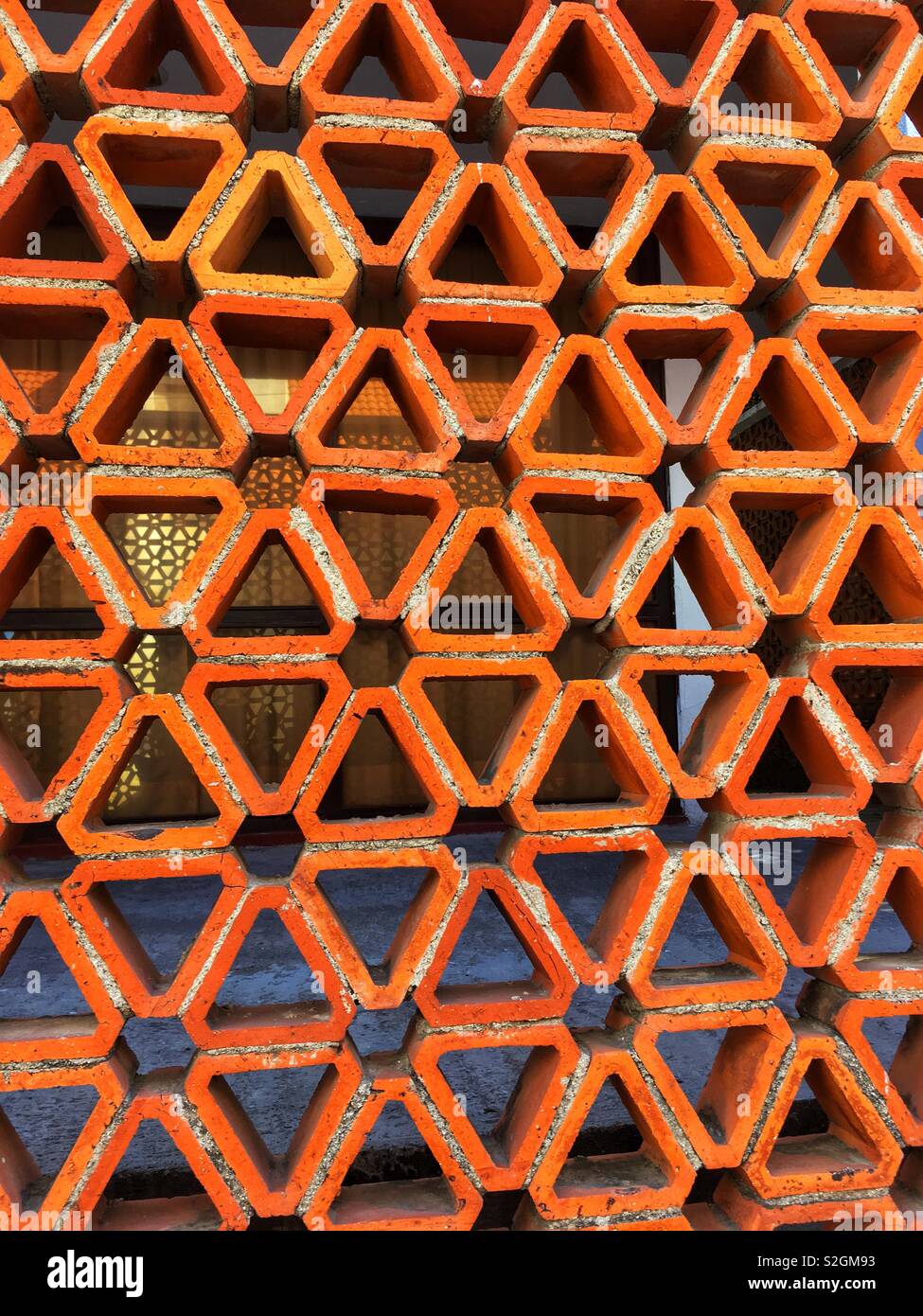 Triangular brick work makes a wall Stock Photo Alamy