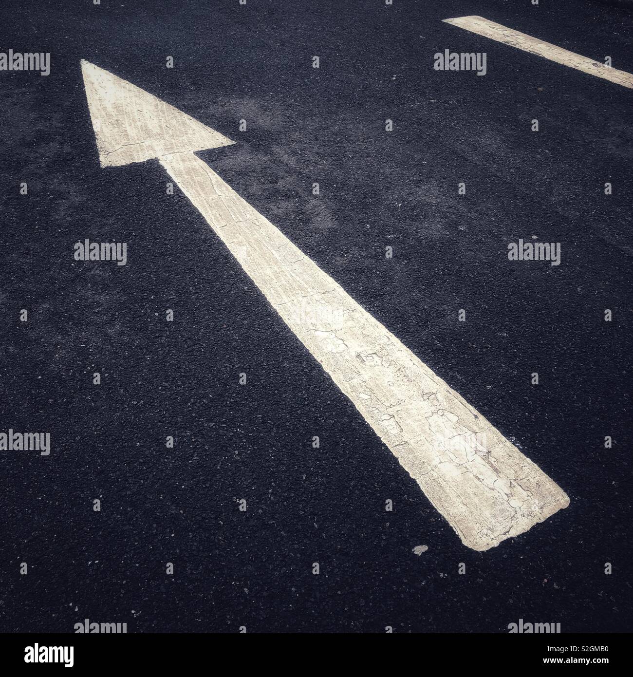 White directional arrow. Scotland. UK. - Smartphone Captured Stock Image