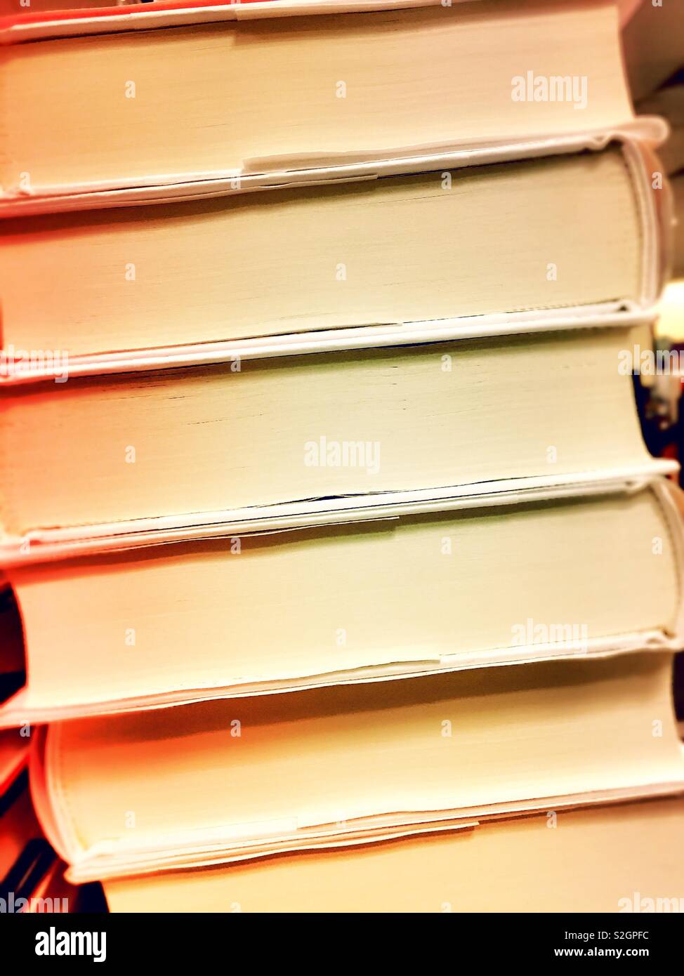 Close up of a stack of hard back books, USA - Smartphone Captured Stock Image
