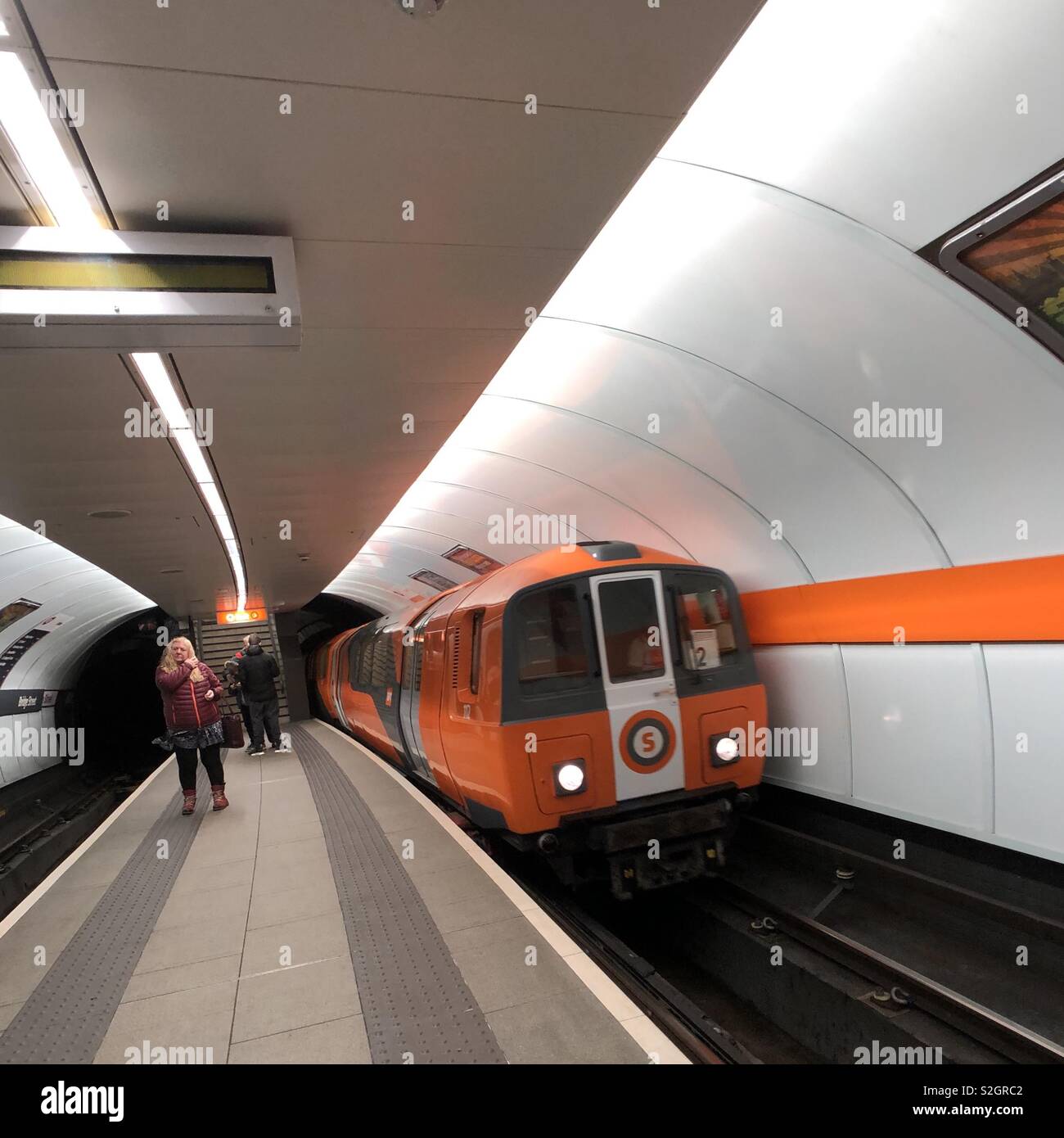 Glasgow subway train arriving at station. Scotland. UK. - Smartphone Captured Stock Image