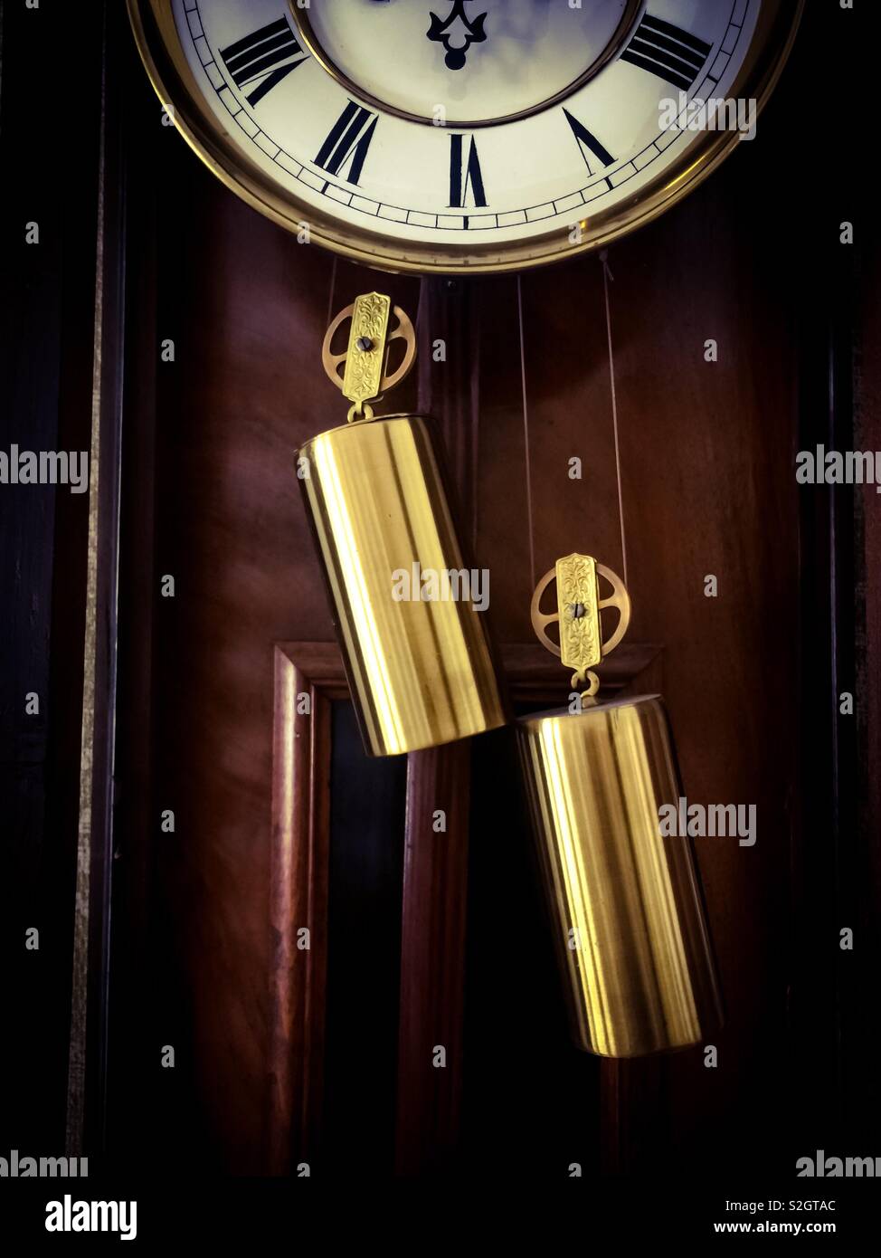 Stuck, an antique clock. Metaphor for arrested time, stopped, a moment