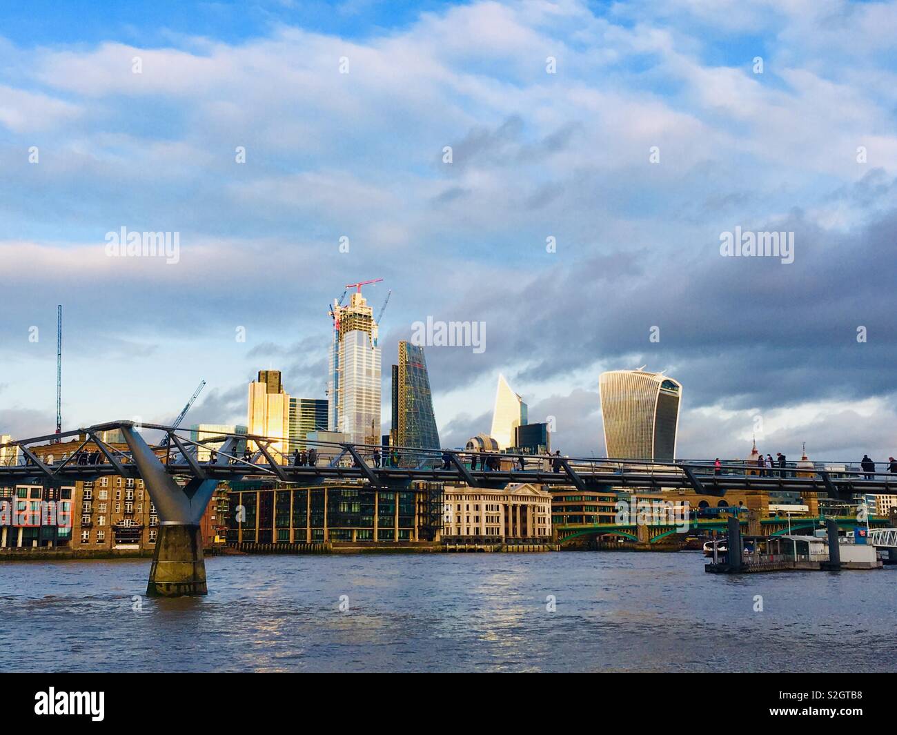 London skyline including river Thames, Millennium Bridge, Walkie Talkie building, Cheese Grater building, cranes and new building work. Stock Photo