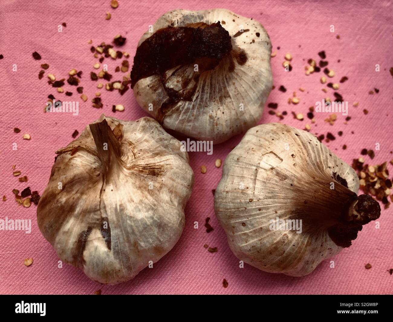 Three roasted garlic bulbs - Smartphone Captured Stock Image