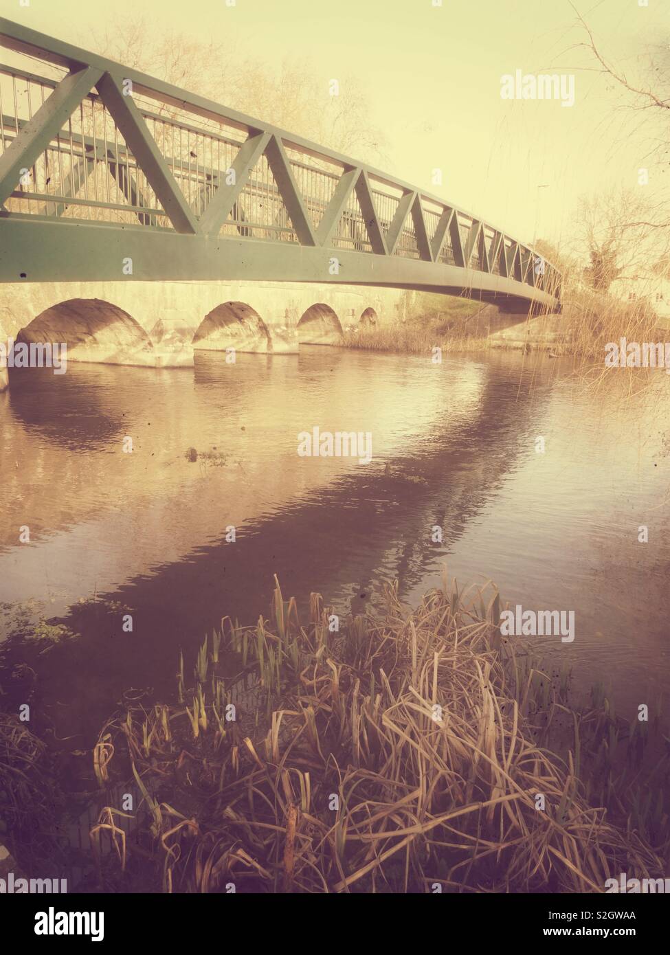 Pedestrian bridge over River Avon at Amesbury Wiltshire UK Stock Photo