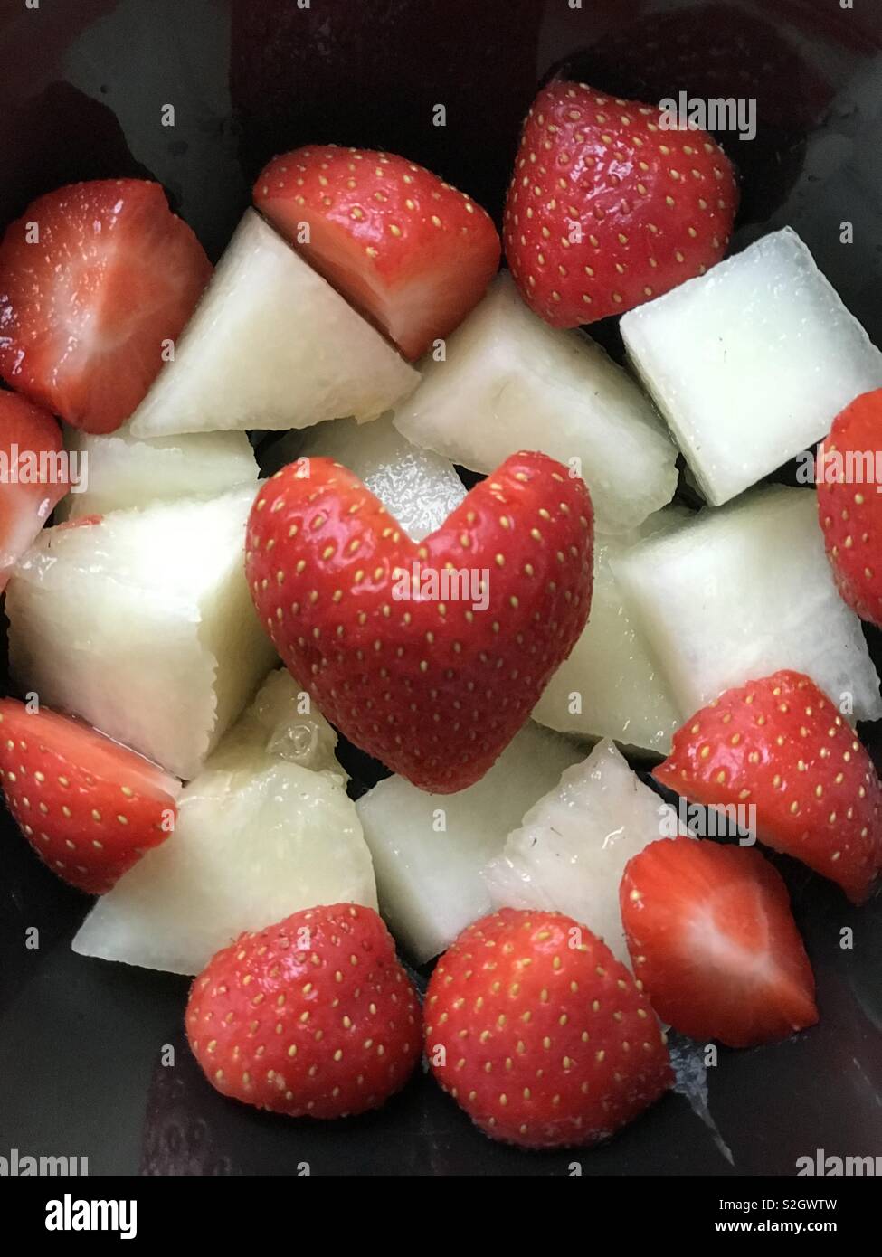 Strawberry heart and melon Stock Photo Alamy