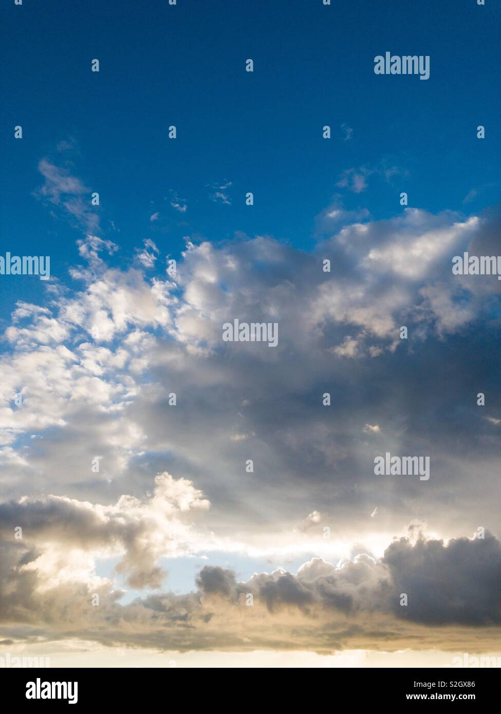 Clouds with light rays Stock Photo