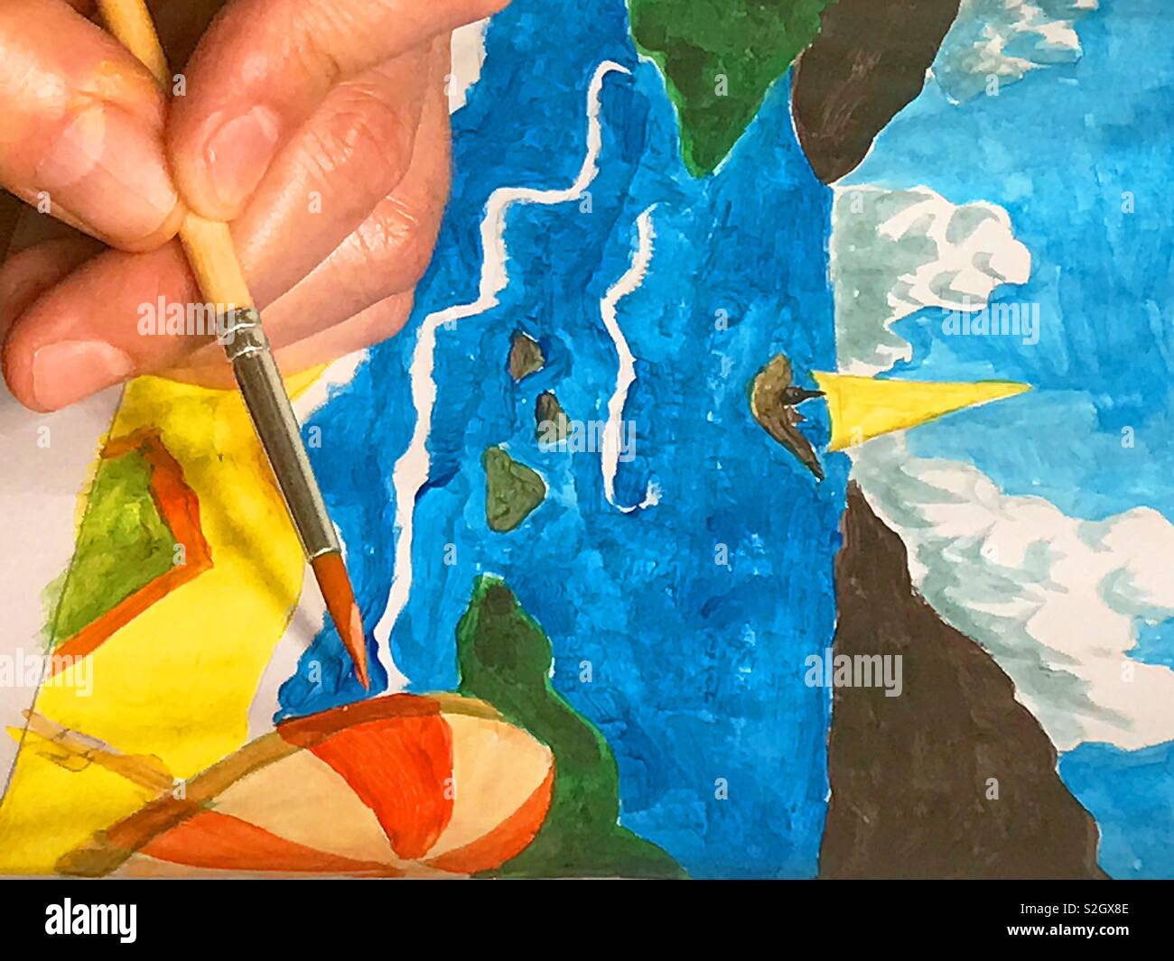 Man's hand painting an illustration Stock Photo Alamy