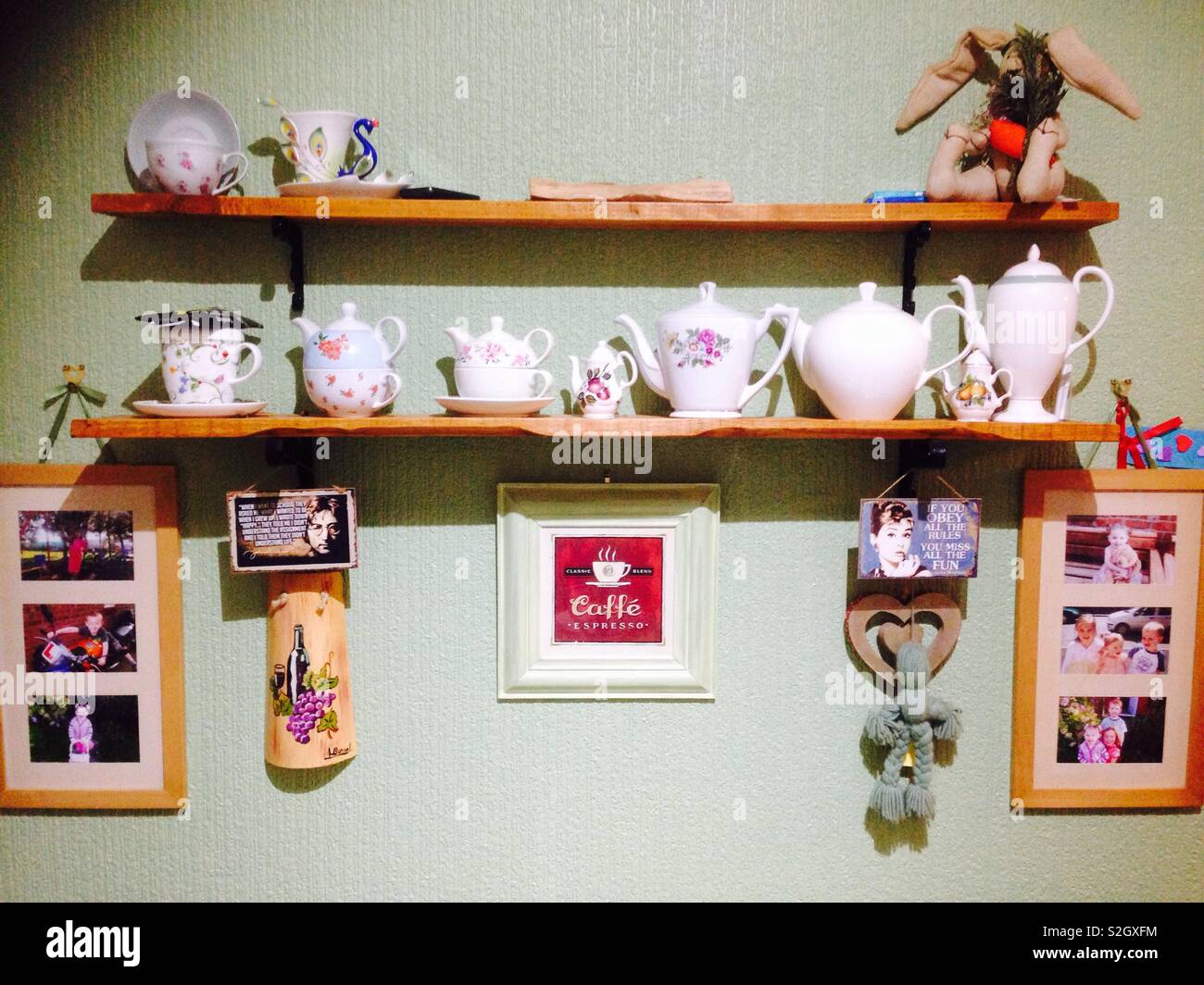 Decorative shelving with quirky objects on a kitchen wall Stock Photo Alamy