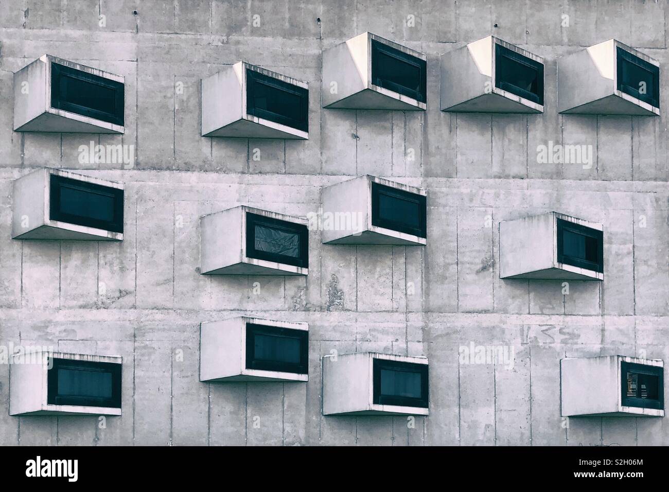 Facade of a building with overhanging windows - Smartphone Captured Stock Image