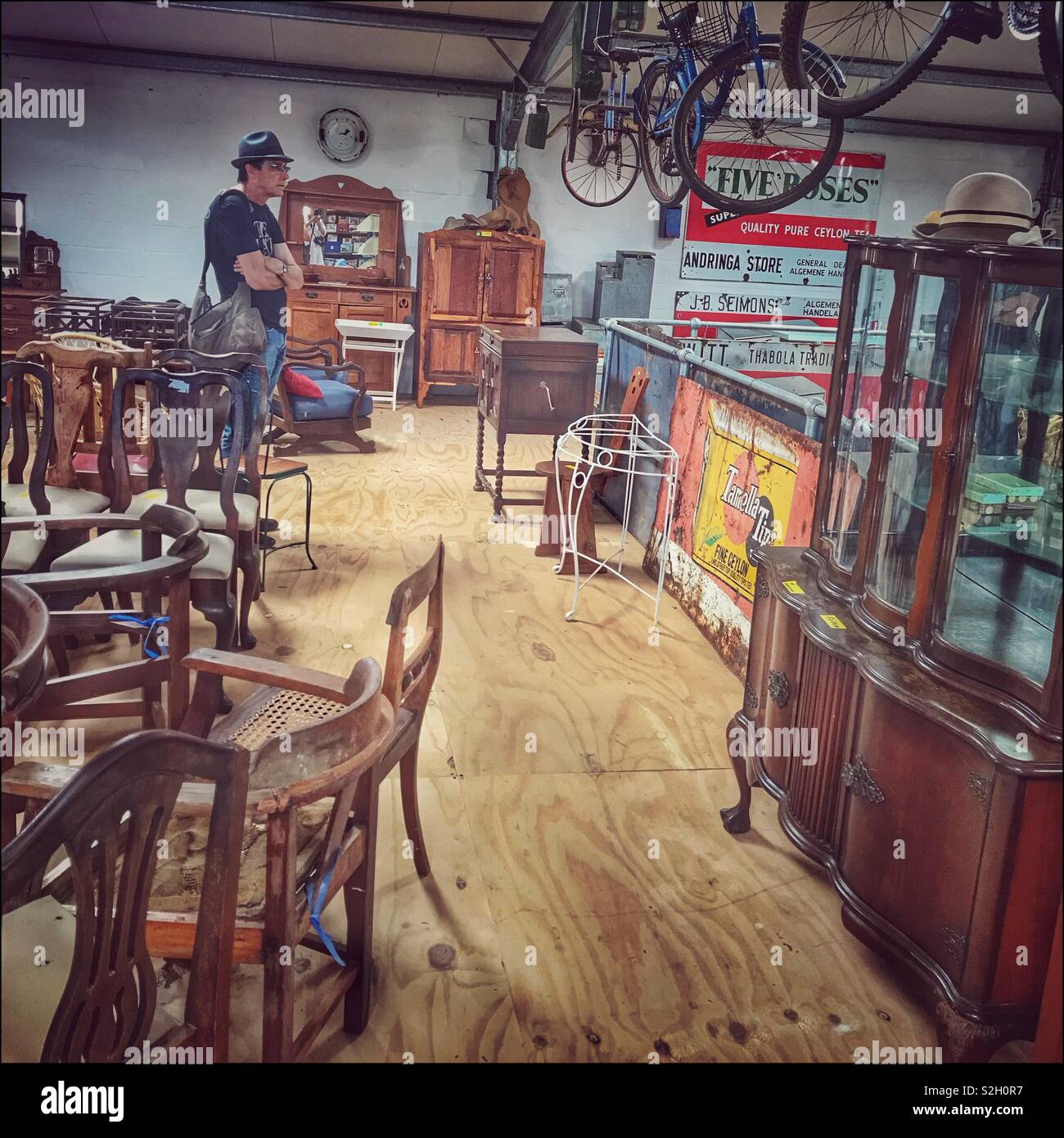 Looking at collectibles in shed at Toeka Stoor, Paarl, South Africa. - Smartphone Captured Stock Image