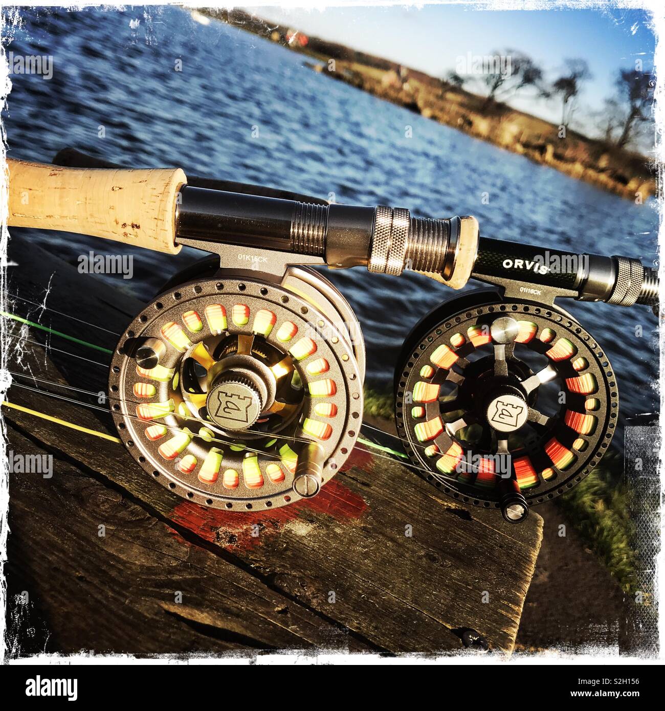 Fly fishing rods and reels at a Stillwater Trout Fishery Stock Photo