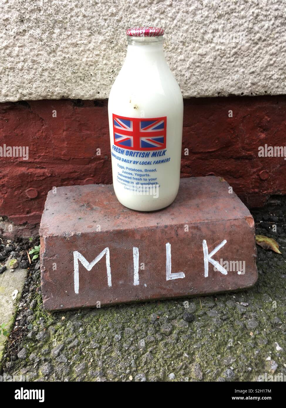 Fresh British milk with Union Jack delivered on doorstep - Smartphone Captured Stock Image