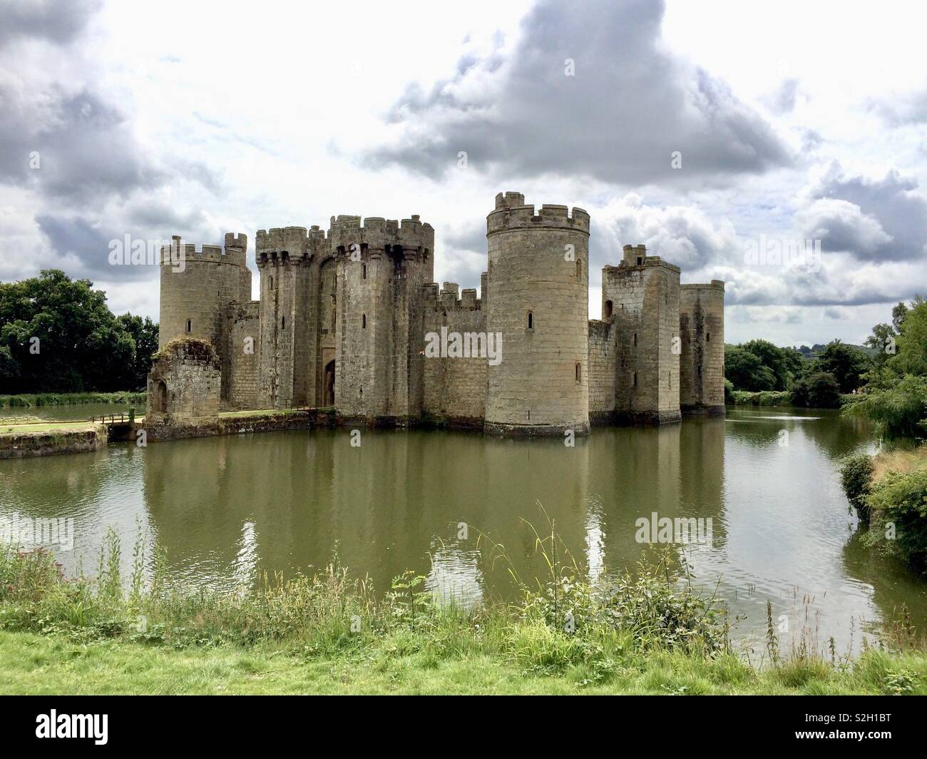 View of Bodiam Castle in Kent across the moat under a cloudy sky - Smartphone Captured Stock Image