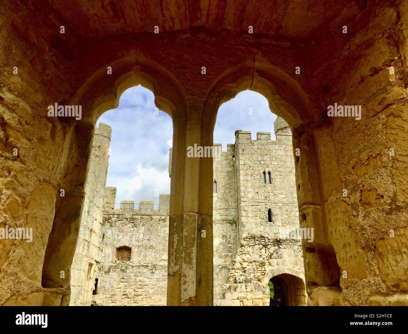 Internal view of Bodiam Castle across courtyard through stone window - Smartphone Captured Stock Image