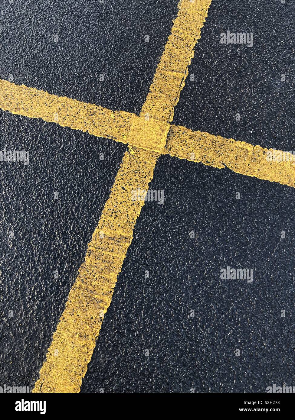Cross shaped road markings. Scotland. UK. - Smartphone Captured Stock Image