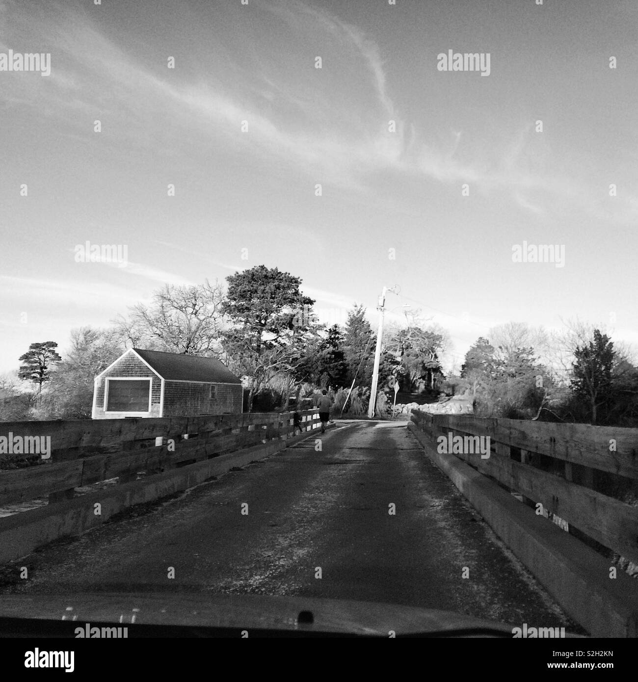 Driving over a small bridge in winter, Cape Cod, Massachusetts, United States - Smartphone Captured Stock Image