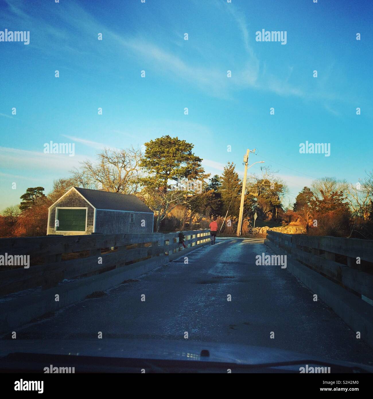 Driving over a small bridge in winter, Cape Cod, Massachusetts, United States - Smartphone Captured Stock Image