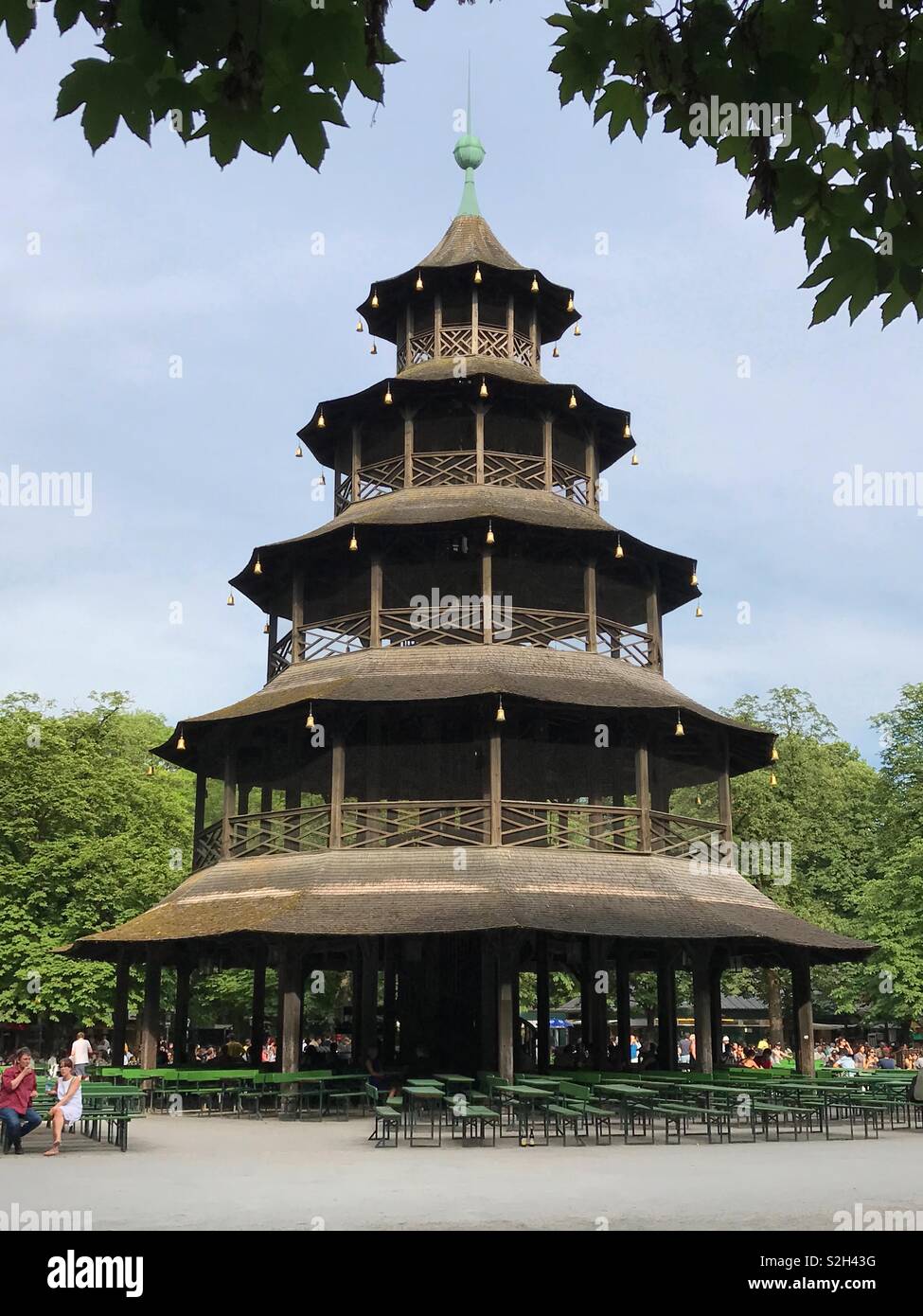 Munich, Germany - June 22, 2017: The historic Chinese Tower in the English Garden park is shown in a vertical view during a summer afternoon day. Stock Photo