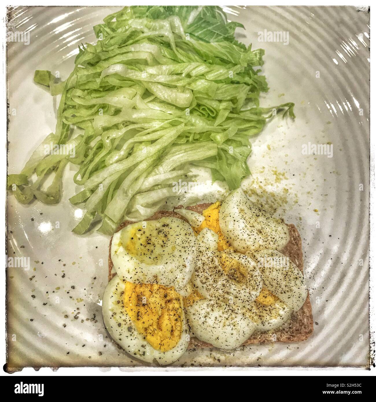 Hard boiled egg on toast with lettuce side Stock Photo Alamy