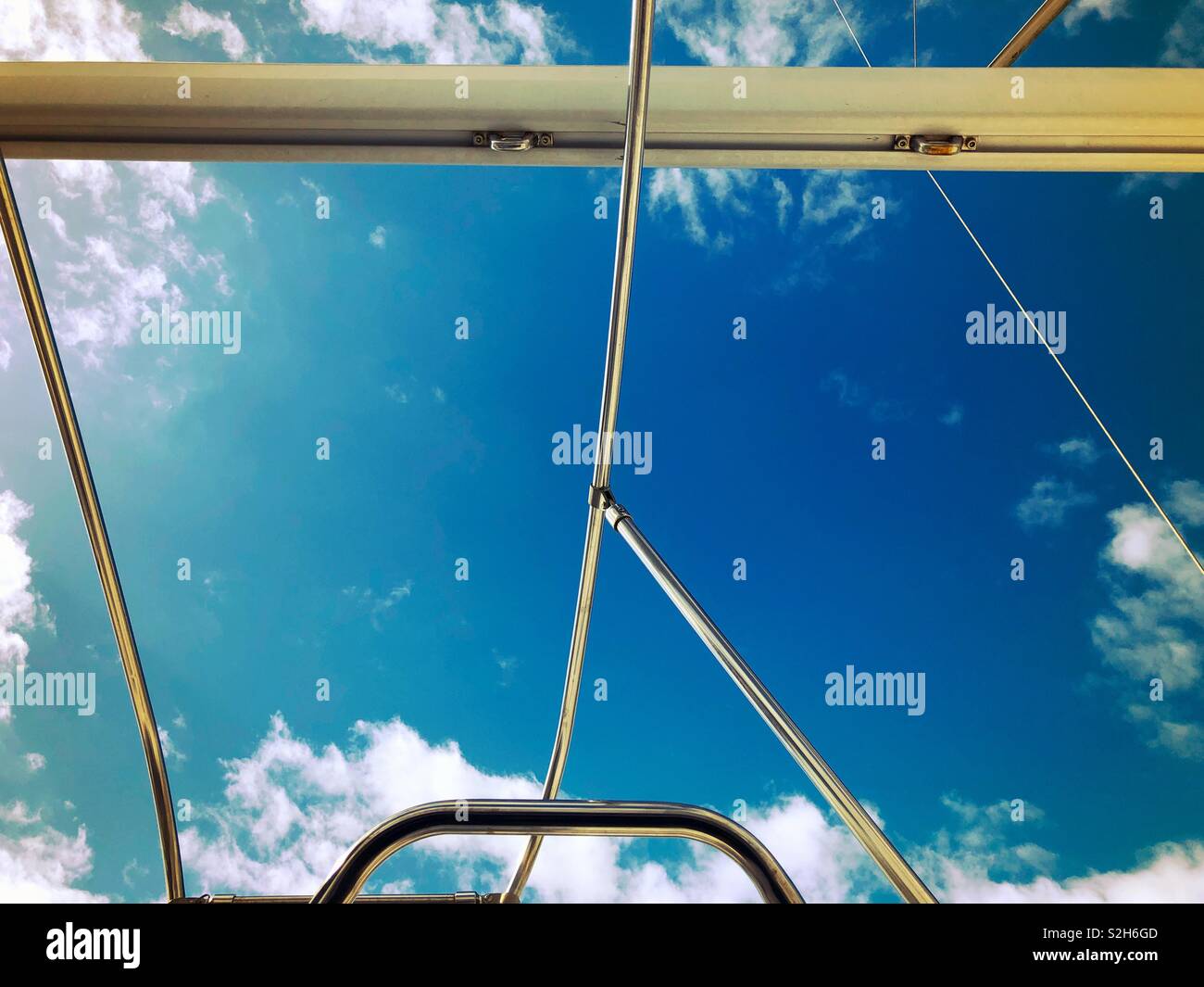 Looking up at the sky through the open window of a sailboat in Florida - Smartphone Captured Stock Image