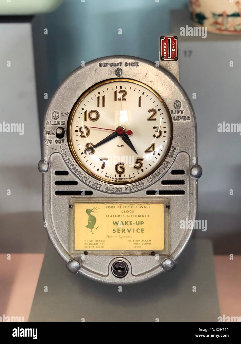 A coin- operated alarm clock from a 1950s American motel. Stock Photo