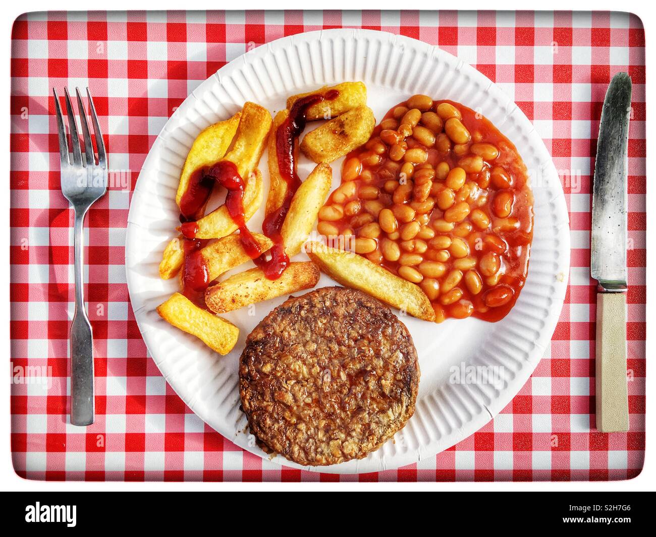 Linda McCartney’s vegetarian mozzarella burger with thickly cut chips and baked beans Stock