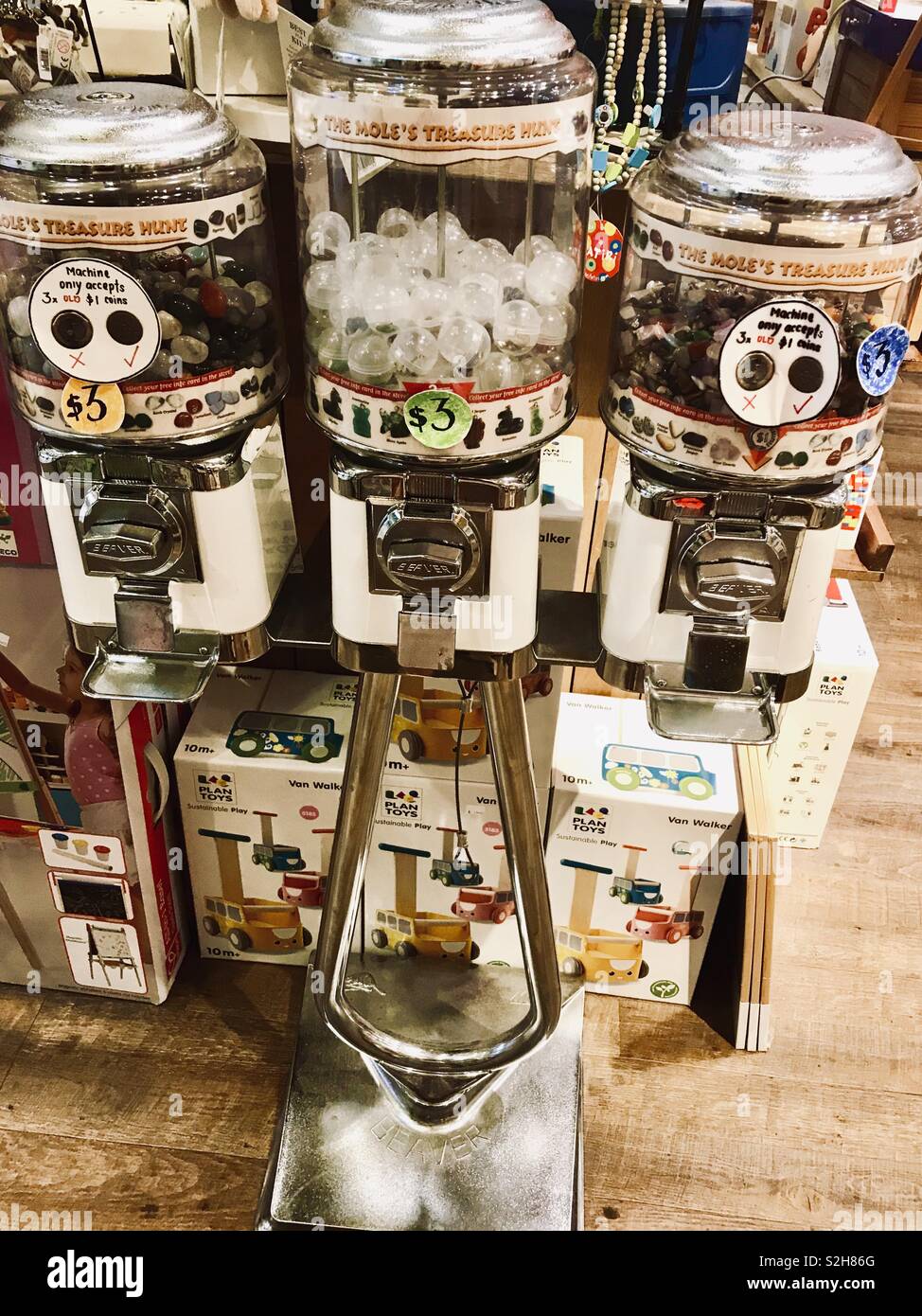 Gumball Vending Machine Dispenser, Children’s sweets in a toy shop Stock Photo