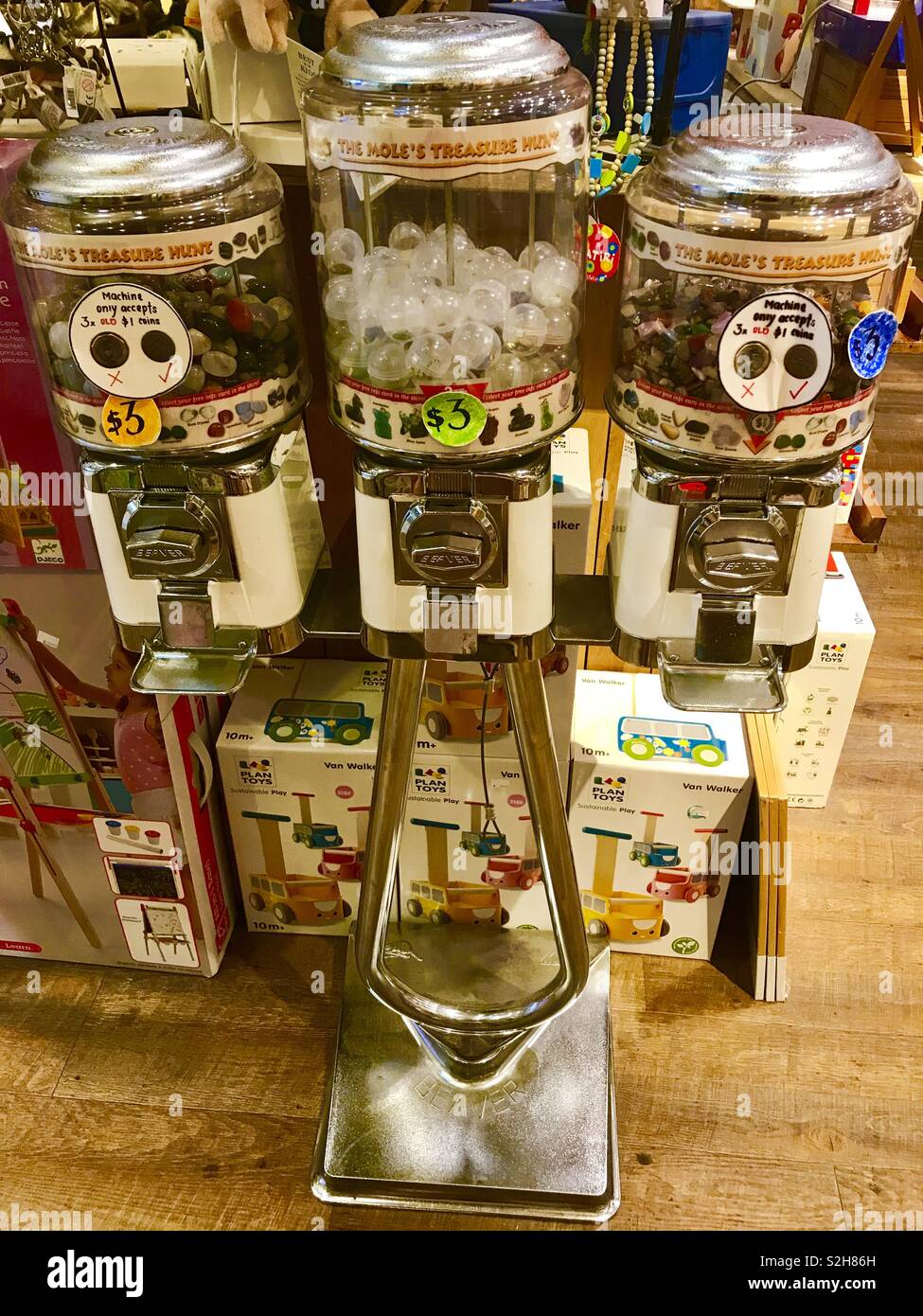 Gumball vending machine dispenser, children’s sweets in a toy shop Stock Photo
