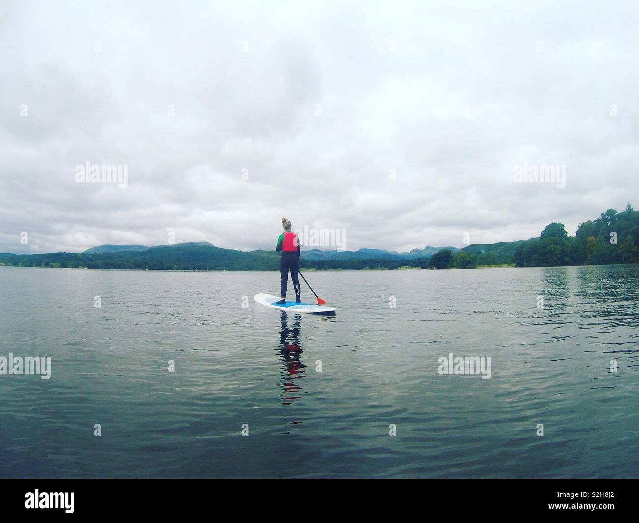 Lake Windermere paddle boarding Stock Photo Alamy