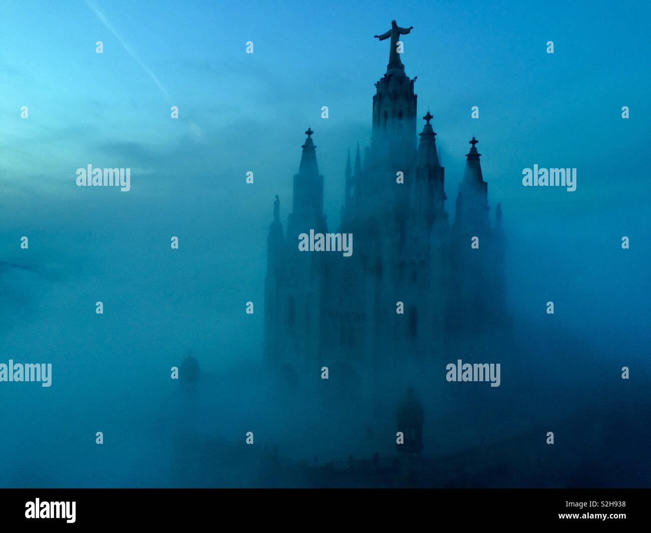 Mystical view of the cathedral in the fog. Stock Photo