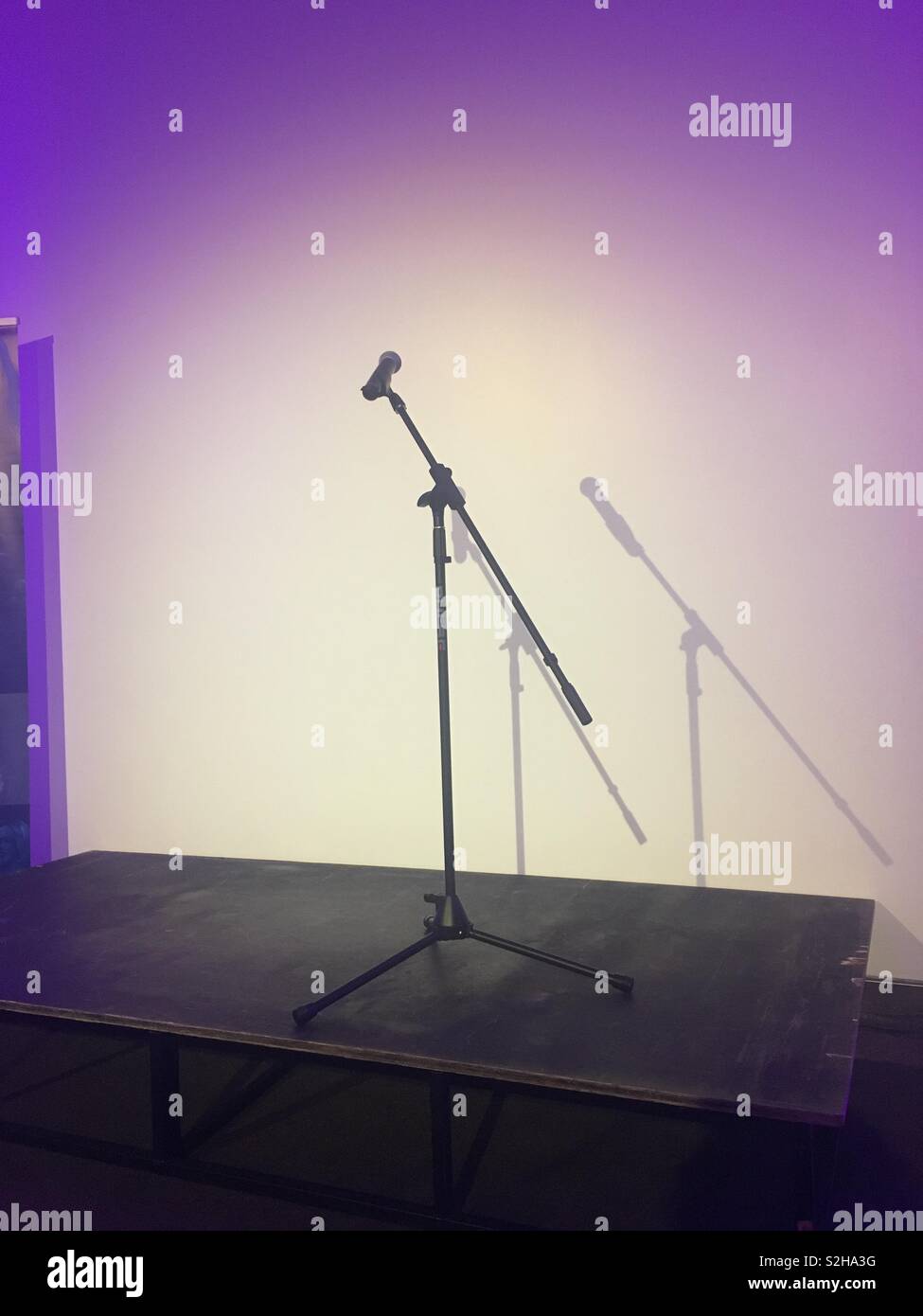 Microphone stand on stage Stock Photo Alamy
