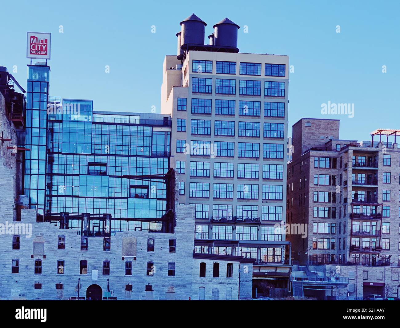 Old mill museum Minneapolis Minnesota and buildings along the river - Smartphone Captured Stock Image