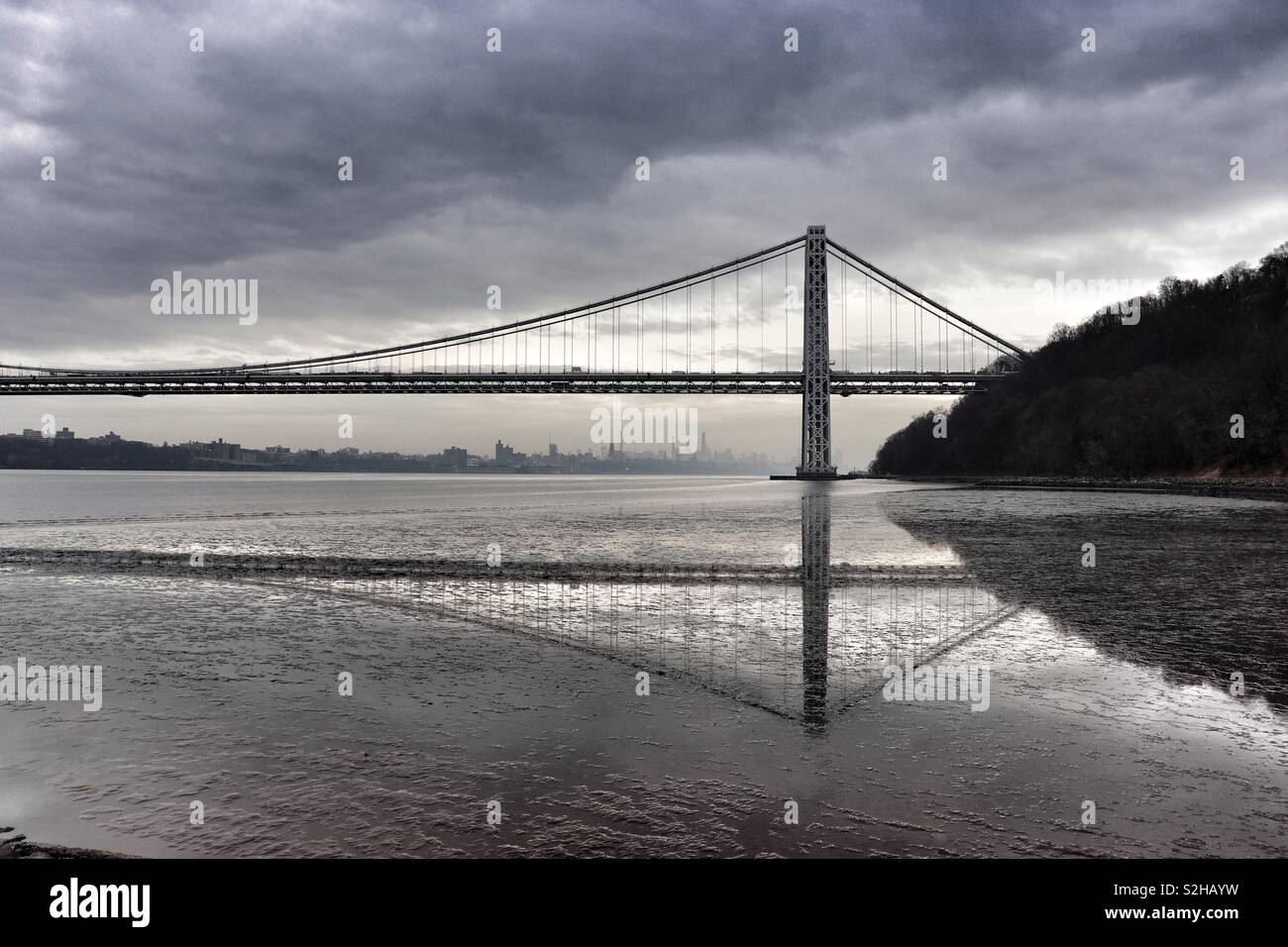 George Washington Bridge casting a reflection on an overcast day Stock Photo