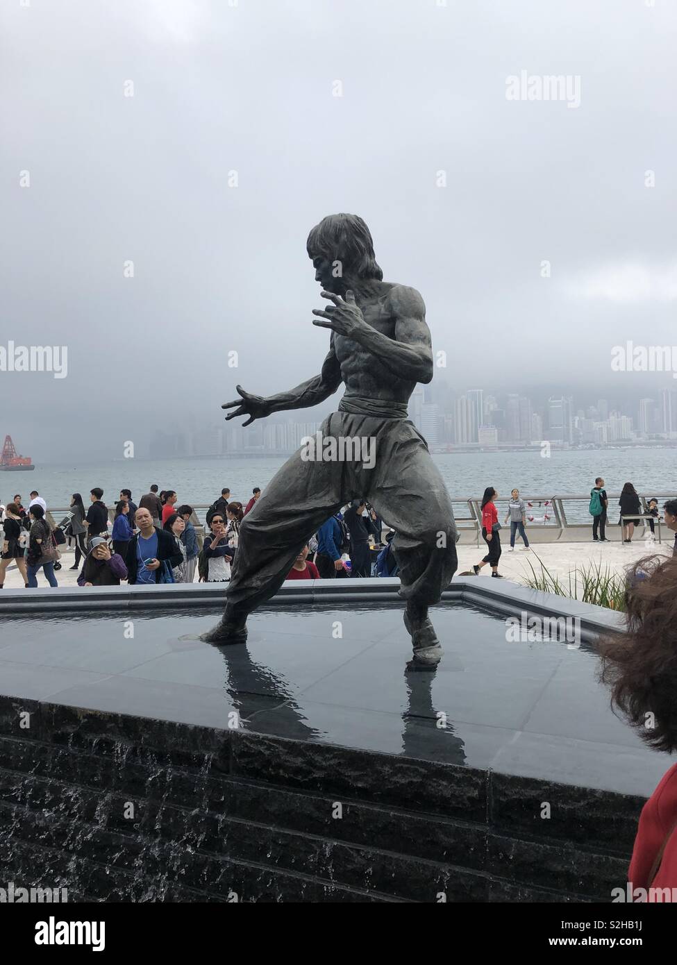 Statue of Bruce Lee on Avenue of Stars in Hong Kong on an overcast February day. Stock Photo