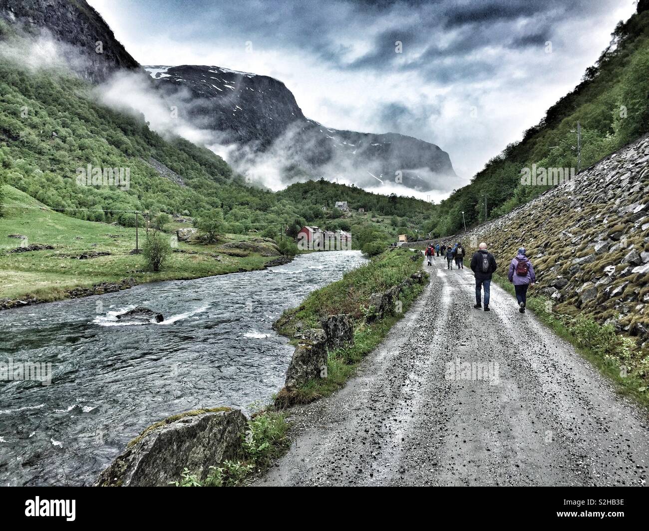 Hiking down the Mountain to Catch the Flam Railway Train back to Flam Village, Norway. Said to be the most beautiful Railway Journey in the world. Spectacular Mountains, Fjords, Glaciers and Rivers. Stock Photo