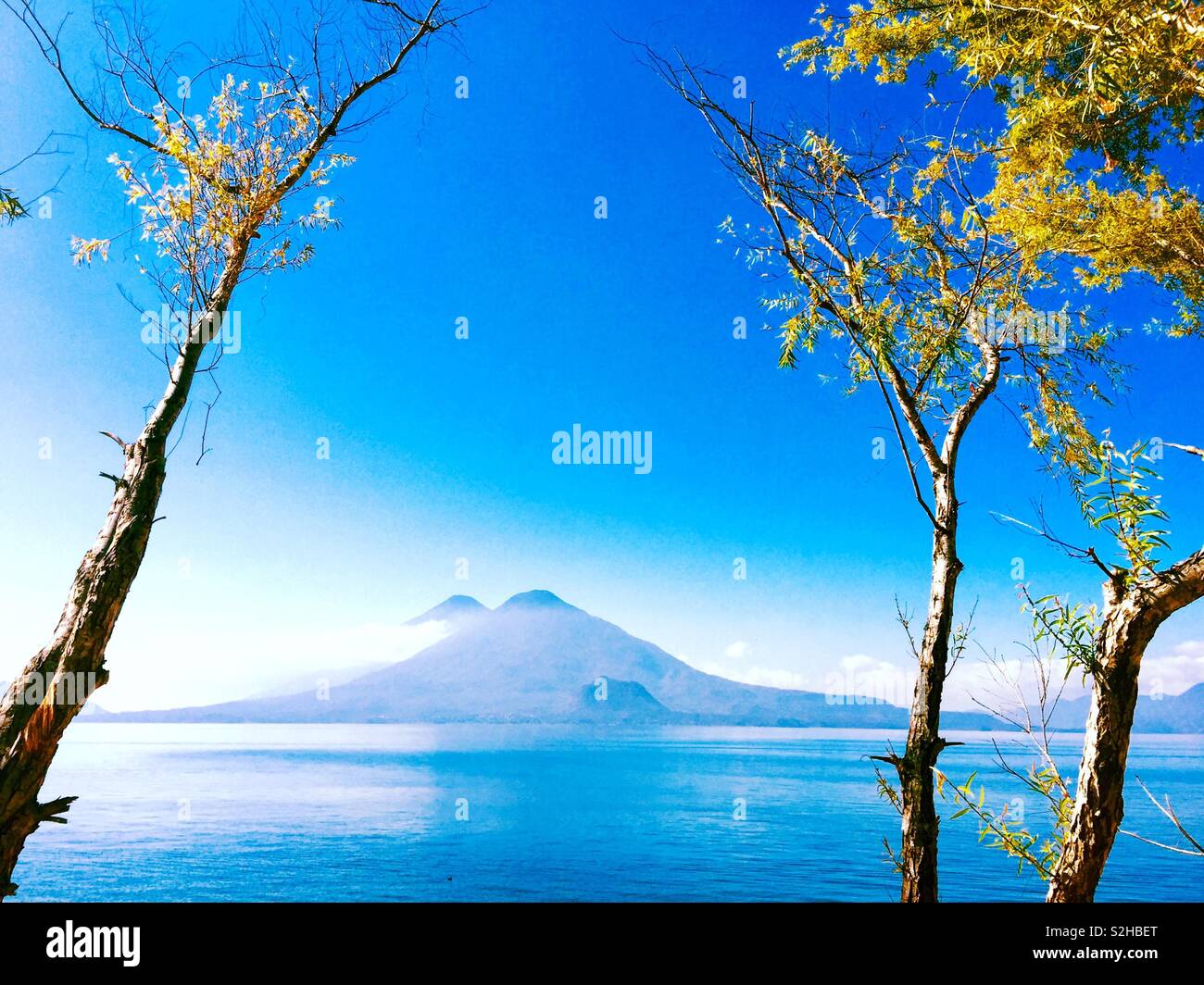 Atitlan & Toliman volcanoes on Lake Atitlan in Guatemalan highlands, Central America - Smartphone Captured Stock Image