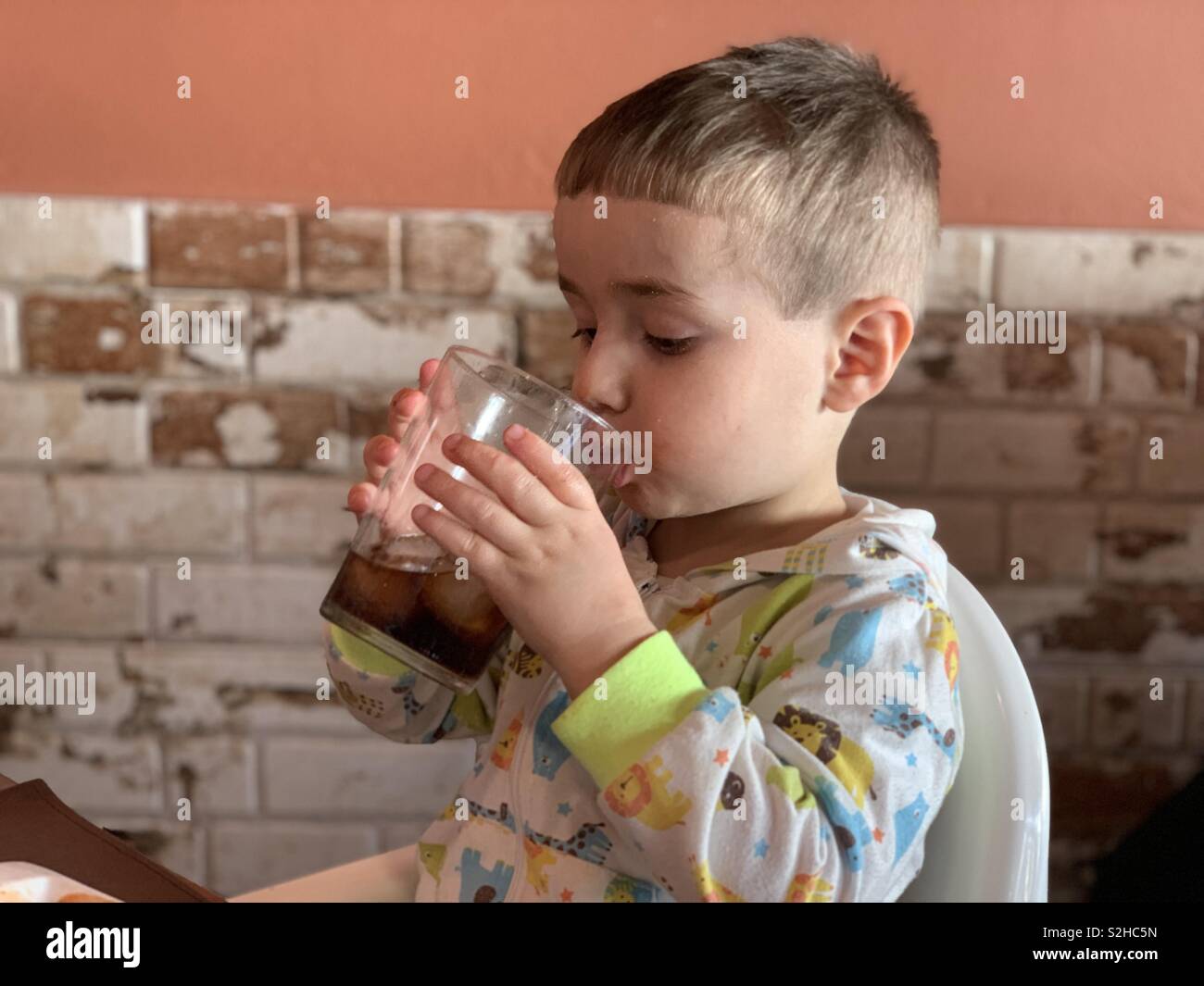 Children drinking coca cola hi-res stock photography and images - Alamy