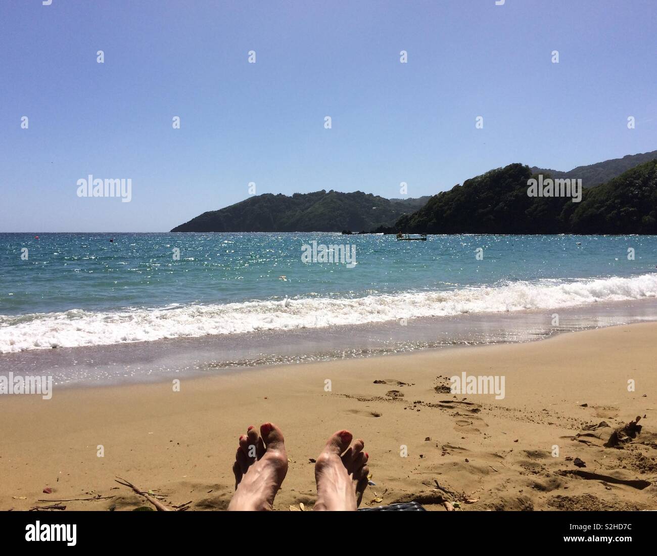 Beach with feet Stock Photo - Alamy