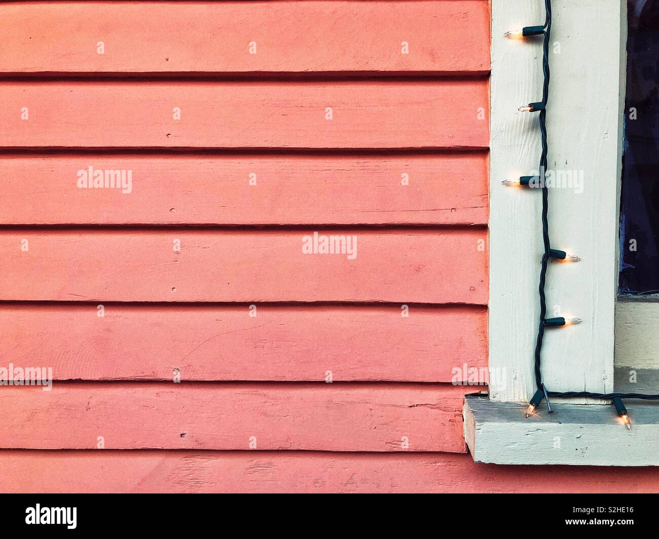 House siding colored in living coral color - Smartphone Captured Stock Image