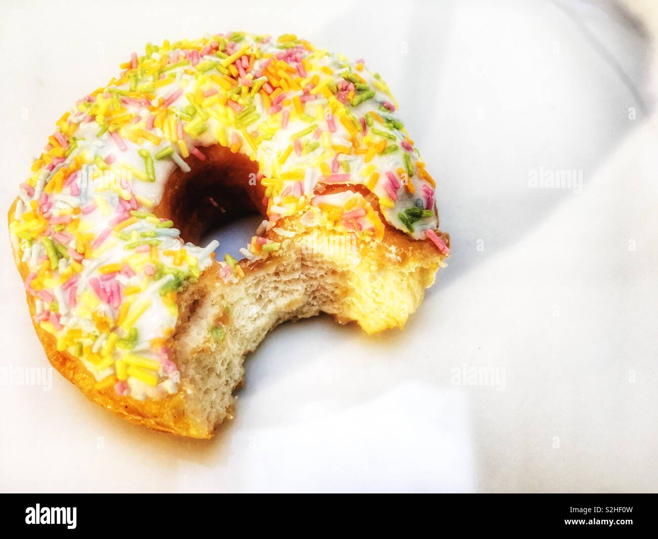 Ring doughnut with bite taken out - Smartphone Captured Stock Image