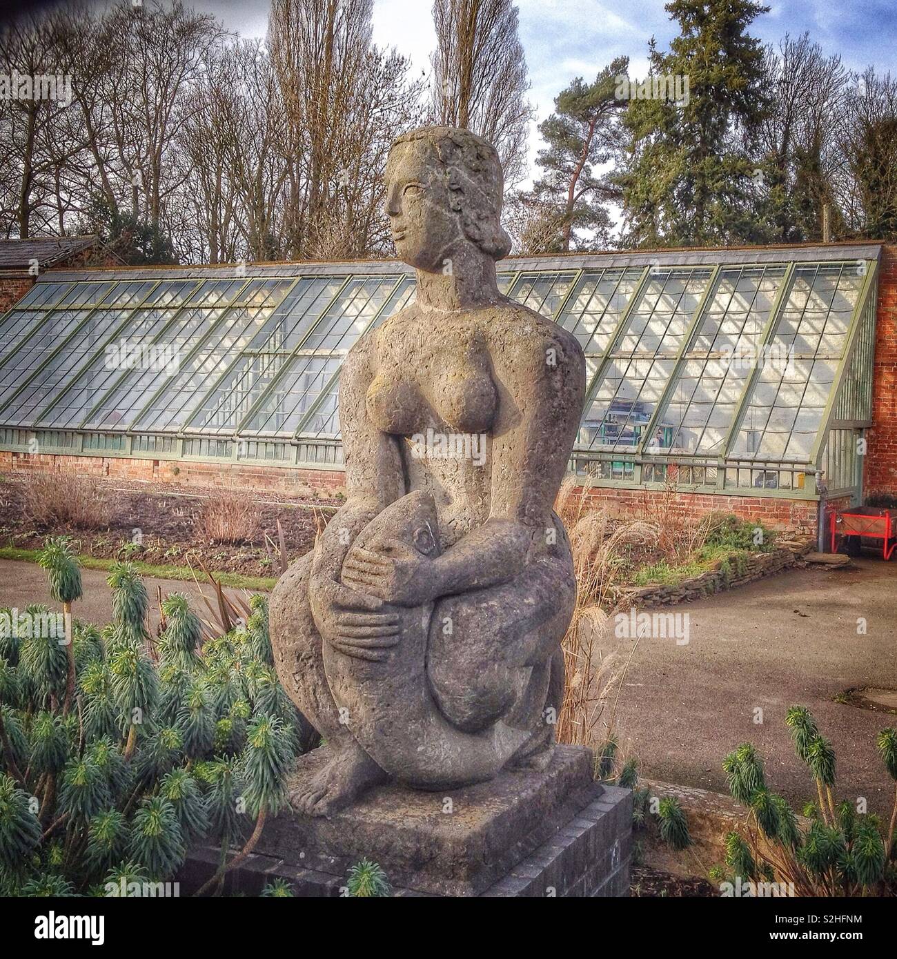 Woman With Fish, a sculpture in the Walled Garden, Delapre Abbey, Northampton, UK - Smartphone Captured Stock Image