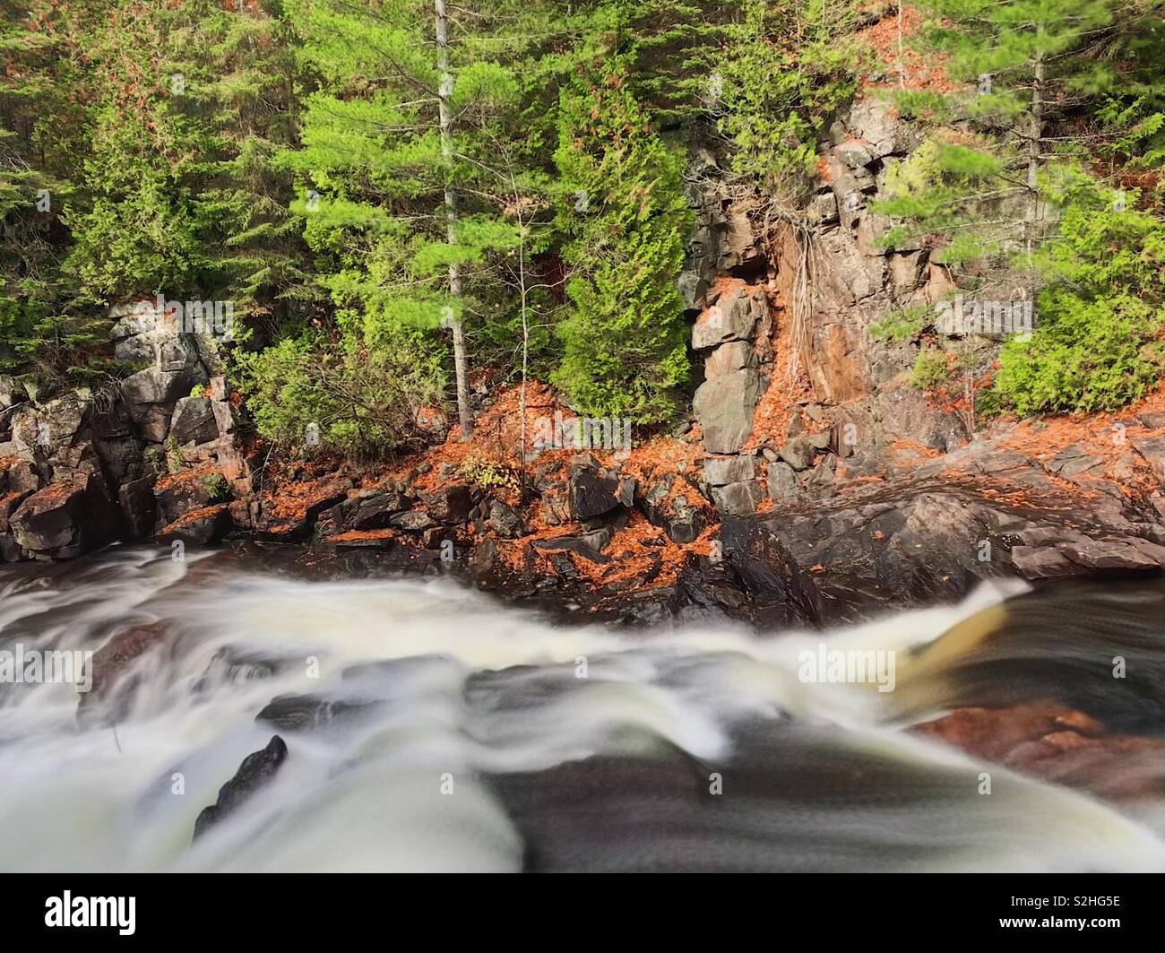 Oxtongue river rapids and shoreline long exposure just outside of ...