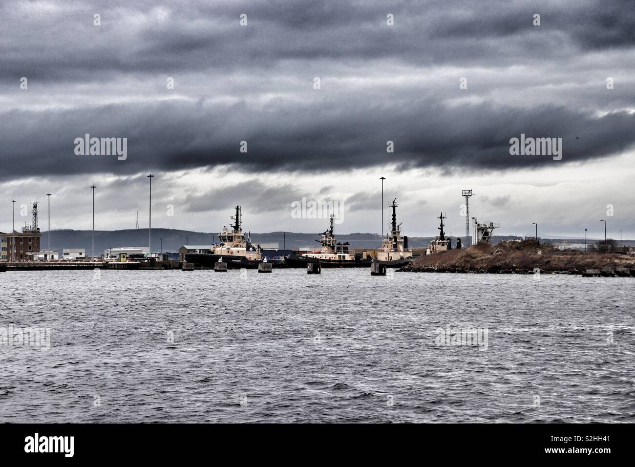 Tug boats moored at Leith Docks in Edinburgh Stock Photo