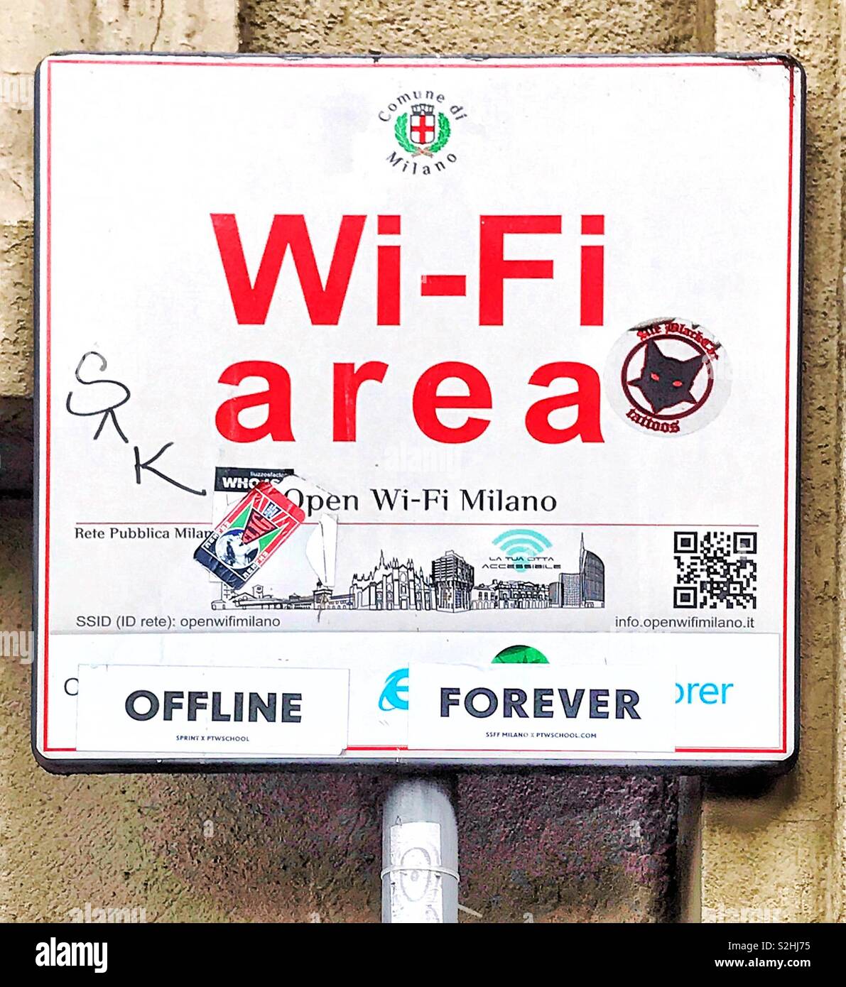 Wi-fi área sign in Milan with stickers protest stickers “offline forever” Stock Photo
