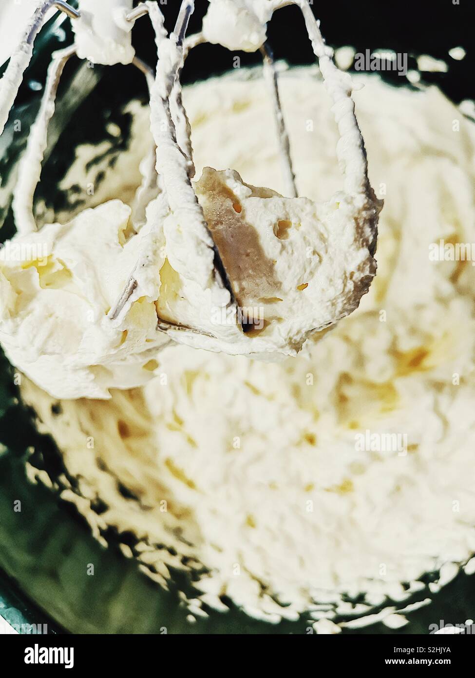 Whisking cream cheese, eggs, caster sugar, vanilla and soured cream to make cheesecake - Smartphone Captured Stock Image