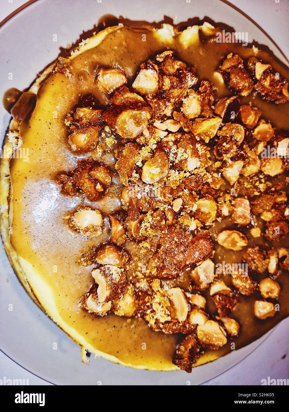 Homemade Macadamia nut and caramel cheesecake Stock Photo