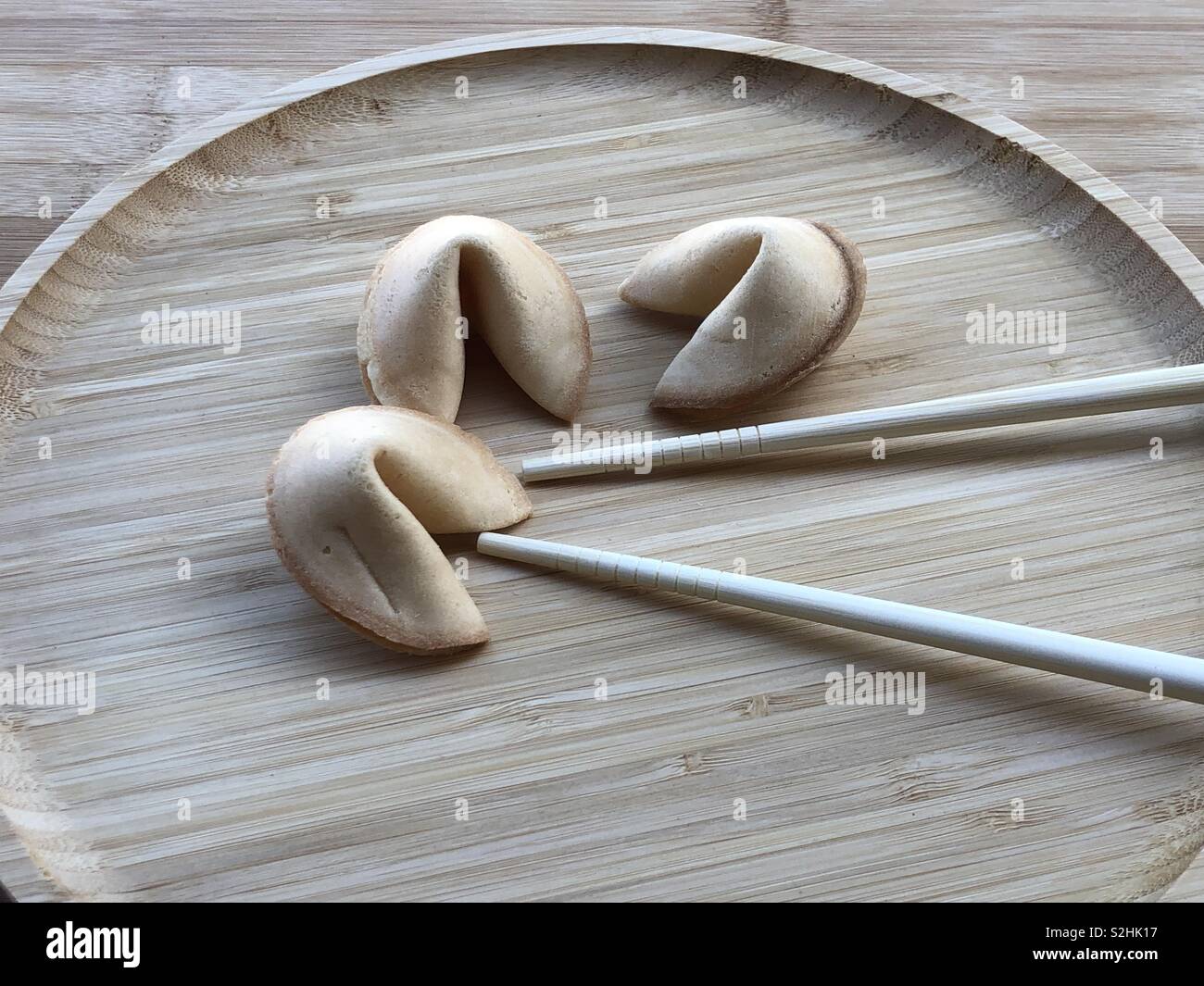 Chinese biscuits of happiness in a wooden plate - Smartphone Captured Stock Image