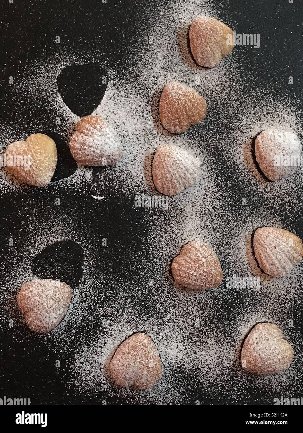 Heart shaped madeleines dusted with powdered sugar Stock Photo