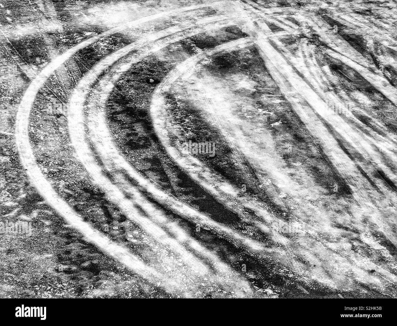 Curved tracks in ice on frozen road, Sweden, Scandinavia - Smartphone Captured Stock Image