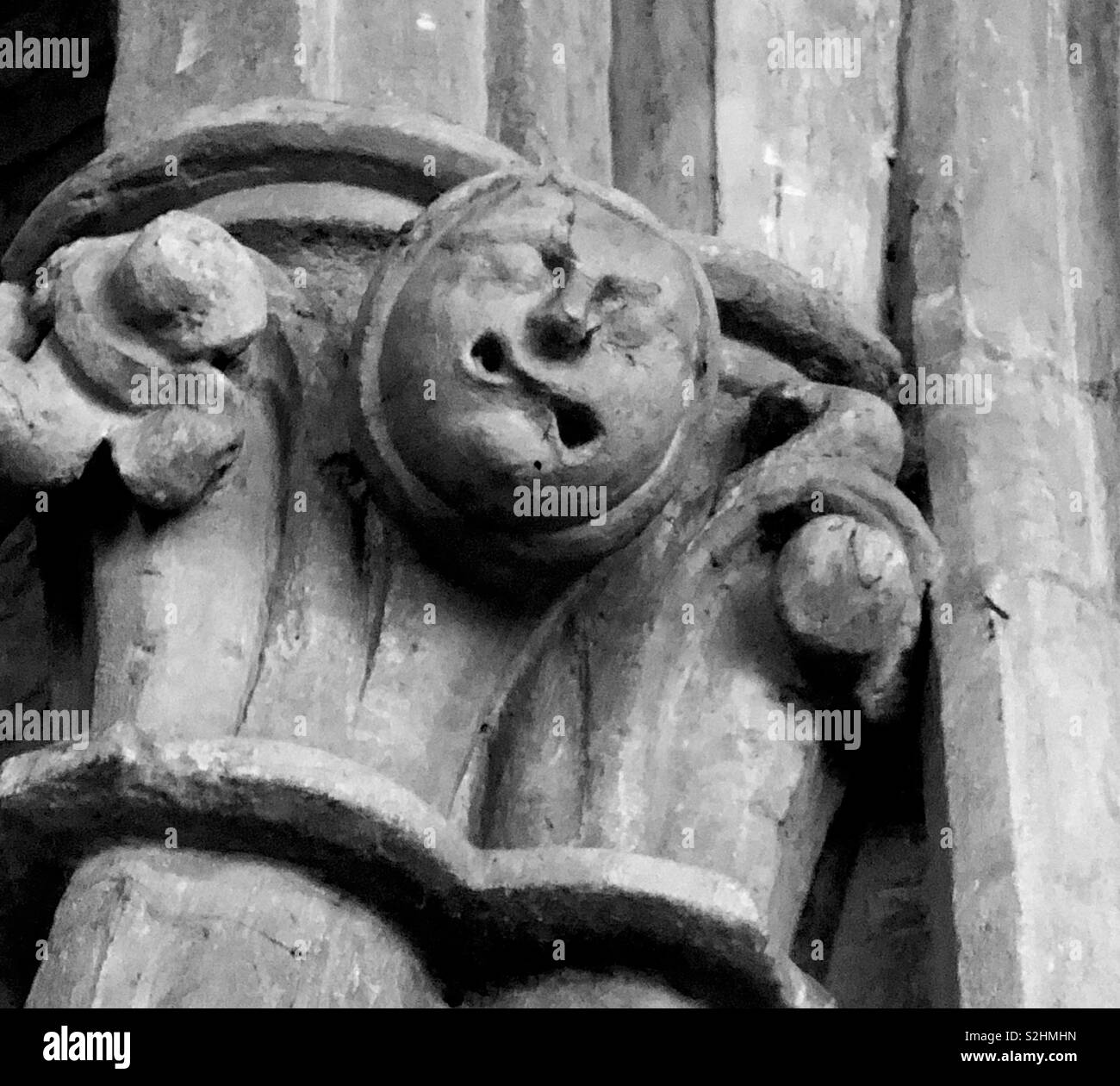 Medieval grotesque with a mouth twisted in pain. - Smartphone Captured Stock Image Medieval grotesque with a mouth twisted in pain. - Smartphone Captured Stock Image